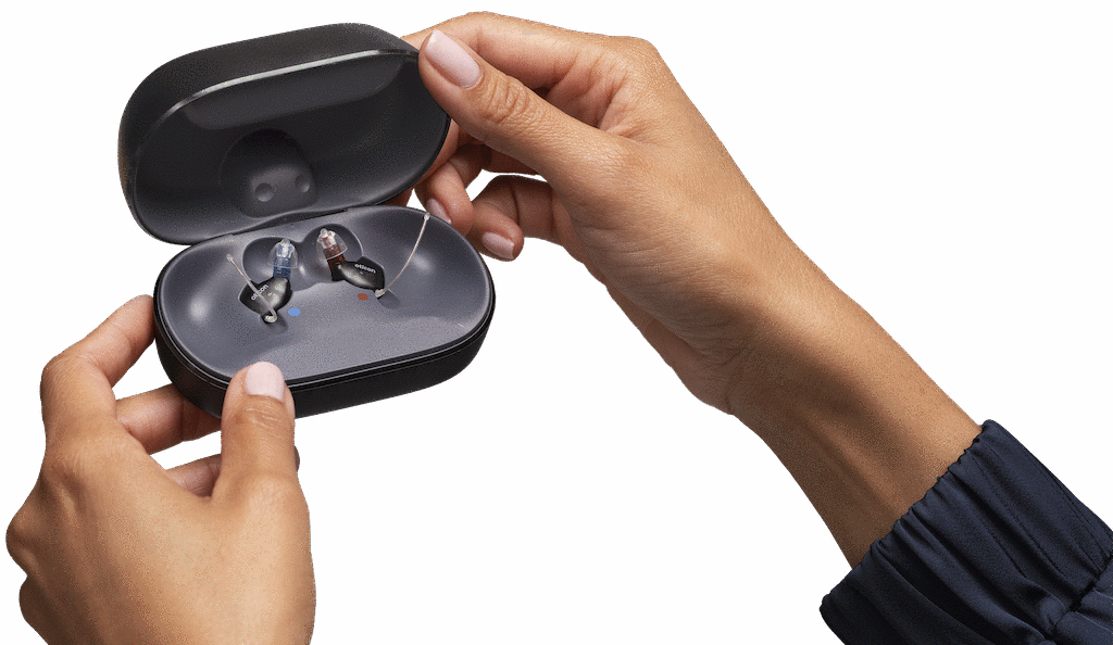 Oticon Zeal hearing aids in their open smart charger case